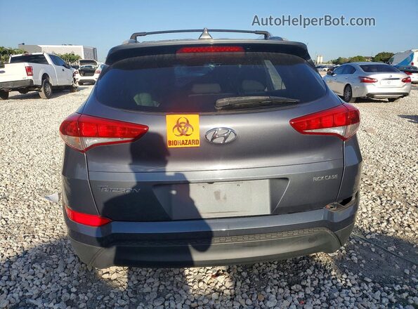 KM8J33A45JU608617 2018 HYUNDAI TUCSON Gray უკანა ხედი