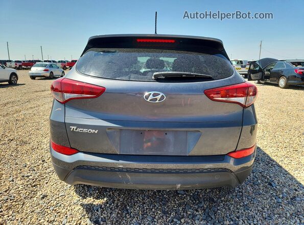 KM8J33A46GU139014 2016 HYUNDAI TUCSON Gray Vista trasera