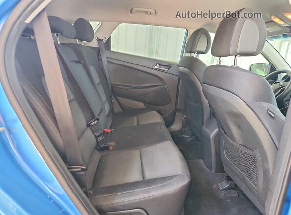 KM8J33A48JU724183 2018 HYUNDAI TUCSON Blue Vista interior trasera