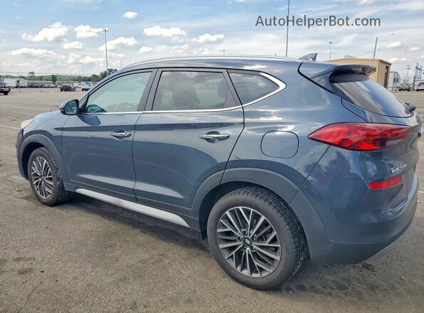 KM8J33AL9MU285149 2021 HYUNDAI TUCSON Gray Trasero izquierdo