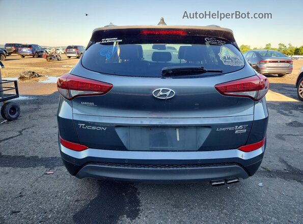 KM8J3CA21GU095907 2016 HYUNDAI TUCSON Gray Widok z tyłu