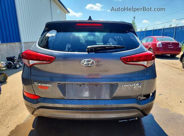 KM8J3CA22GU033884 2016 HYUNDAI TUCSON Gray Rear view