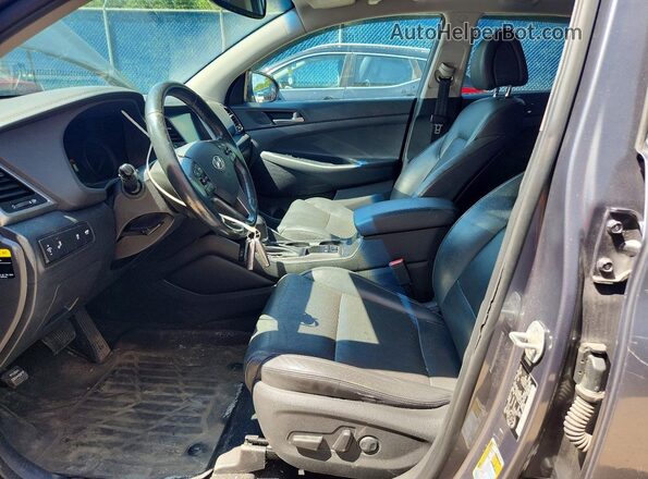 KM8J3CA22GU033884 2016 HYUNDAI TUCSON Gray Front interior view