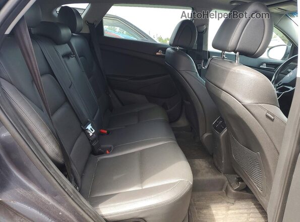 KM8J3CA22GU033884 2016 HYUNDAI TUCSON Gray Rear interior view