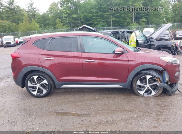 KM8J3CA22HU308414 2017 HYUNDAI TUCSON Red Widok wnętrza z tyłu