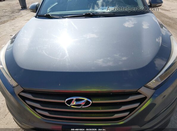 KM8J3CA23GU164743 2016 HYUNDAI TUCSON Gray Вид спереду