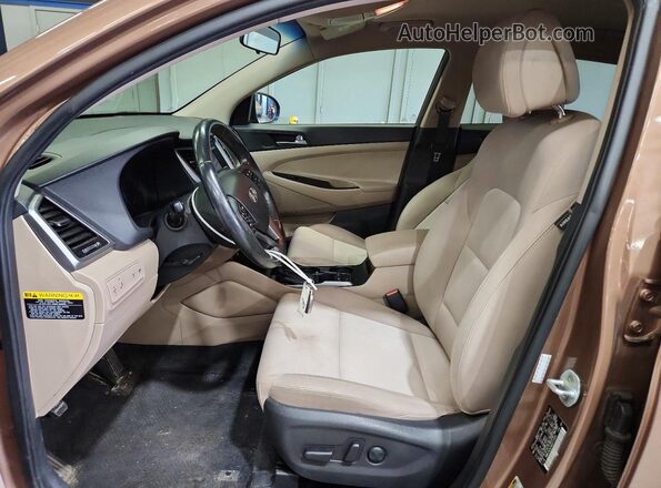 KM8J3CA24GU213593 2016 HYUNDAI TUCSON Brown Front interior view