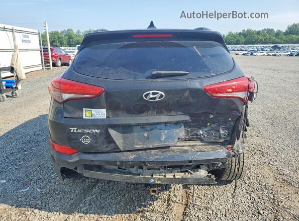 KM8J3CA27GU059042 2016 HYUNDAI TUCSON Black Vista trasera