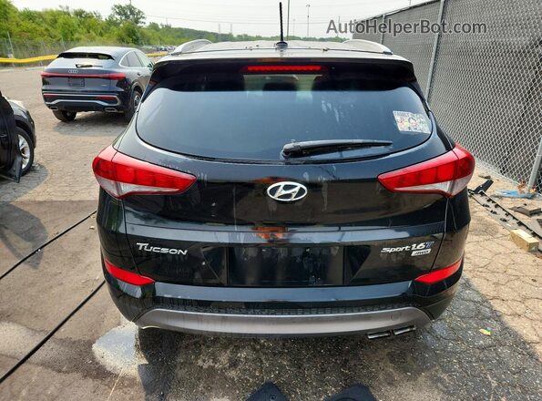 KM8J3CA28GU236262 2016 HYUNDAI TUCSON Black Rear view