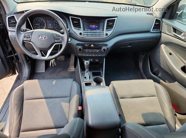 KM8J3CA28GU236262 2016 HYUNDAI TUCSON Black Dashboard view