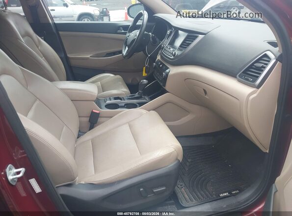 KM8J3CA29GU120696 2016 HYUNDAI TUCSON Maroon Vista interior delantera
