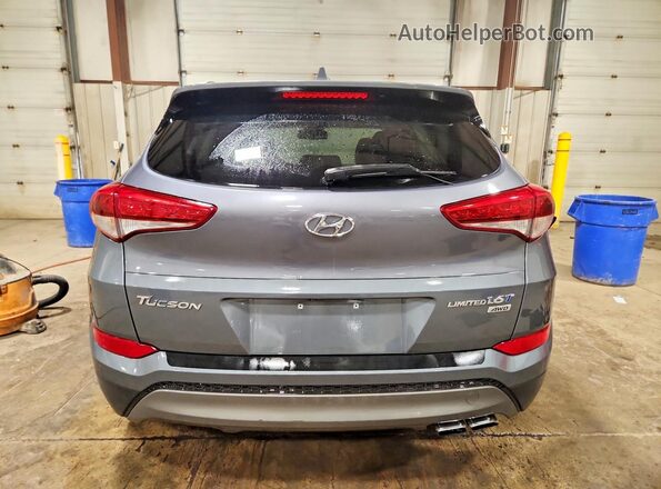KM8J3CA29GU159000 2016 HYUNDAI TUCSON Gray Widok z tyłu