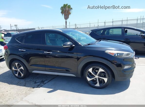 KM8J3CA29HU394644 2017 HYUNDAI TUCSON Black Սալոնի հետևի տեսք