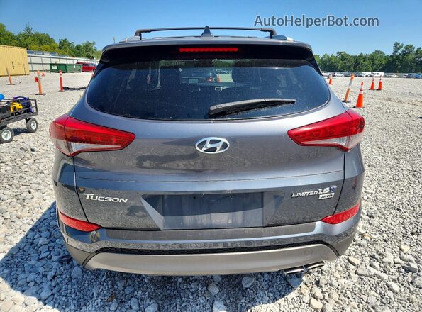 KM8J3CA2XGU251698 2016 HYUNDAI TUCSON Gray Widok z tyłu
