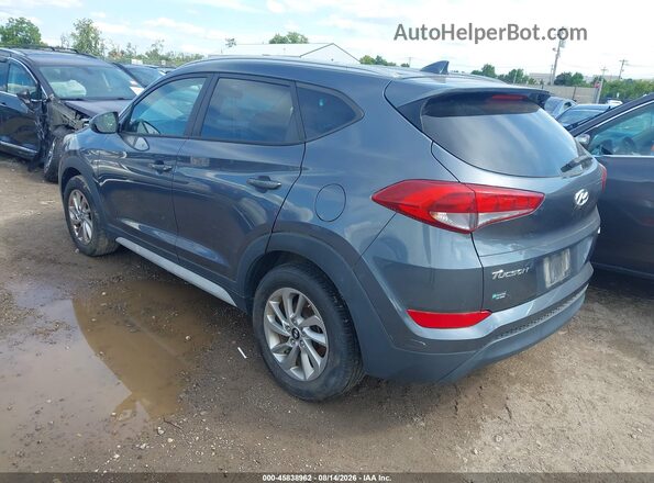 KM8J3CA40JU597302 2018 HYUNDAI TUCSON Gray Trasero izquierdo