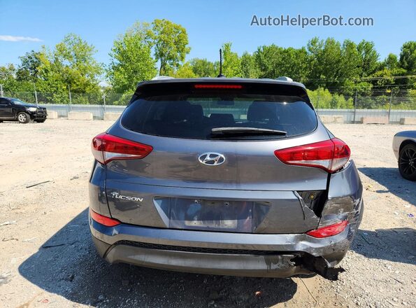 KM8J3CA41GU087954 2016 HYUNDAI TUCSON Gray Widok z tyłu