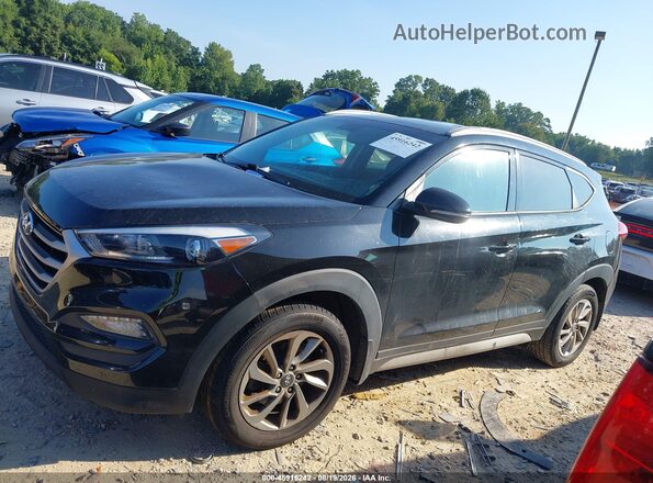 KM8J3CA41HU409784 2017 HYUNDAI TUCSON Black Vista interior trasera
