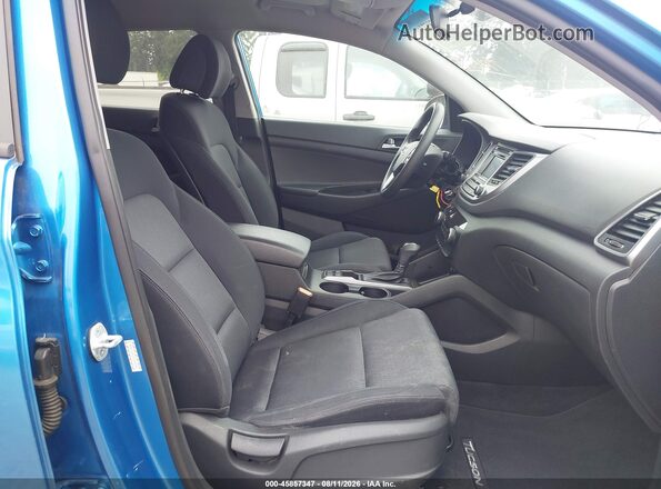 KM8J3CA43GU036696 2016 HYUNDAI TUCSON Blue Front interior view