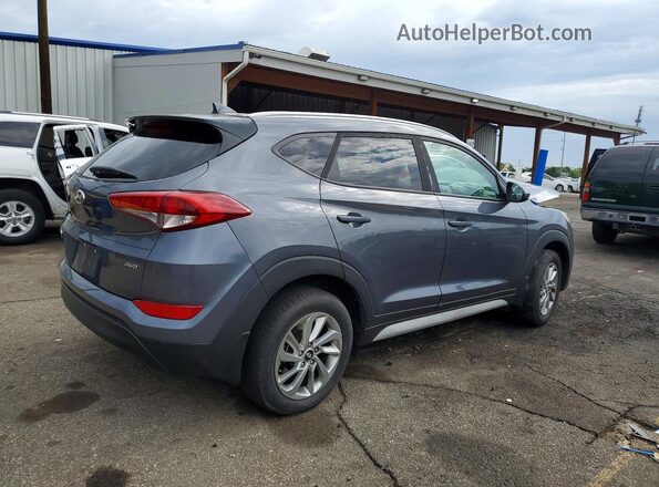 KM8J3CA45JU608357 2018 HYUNDAI TUCSON Gray Trasero derecho