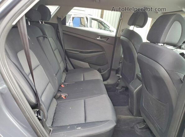 KM8J3CA45JU608357 2018 HYUNDAI TUCSON Gray Vista de los asientos traseros