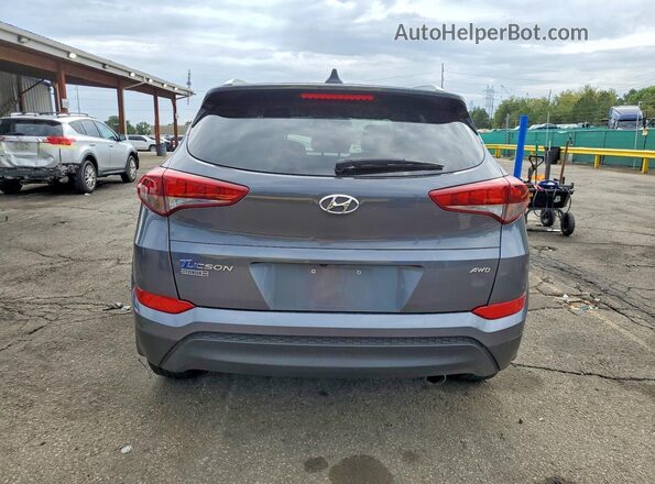KM8J3CA45JU608357 2018 HYUNDAI TUCSON Gray Vista trasera