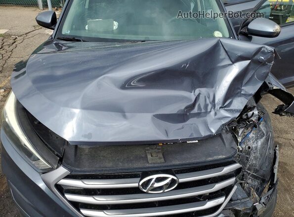 KM8J3CA45JU608357 2018 HYUNDAI TUCSON Gray Vista interior trasera