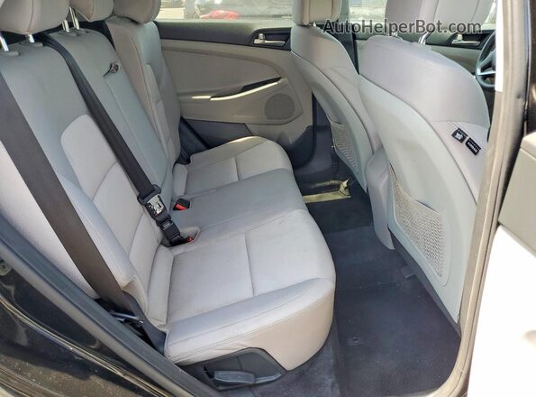 KM8J3CA47JU694643 2018 HYUNDAI TUCSON Black Vista interior trasera
