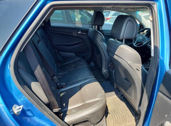 KM8J3CA4XHU497539 2017 HYUNDAI TUCSON Blue Rear interior view