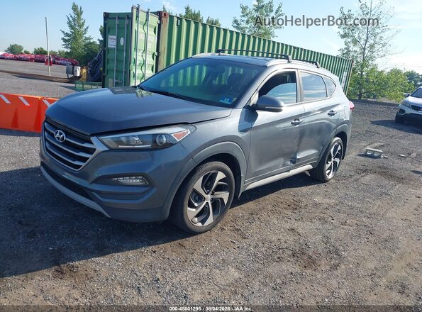 KM8J3CAL7JU716583 2018 HYUNDAI TUCSON Gray Vista tres cuartos delantera izquierda