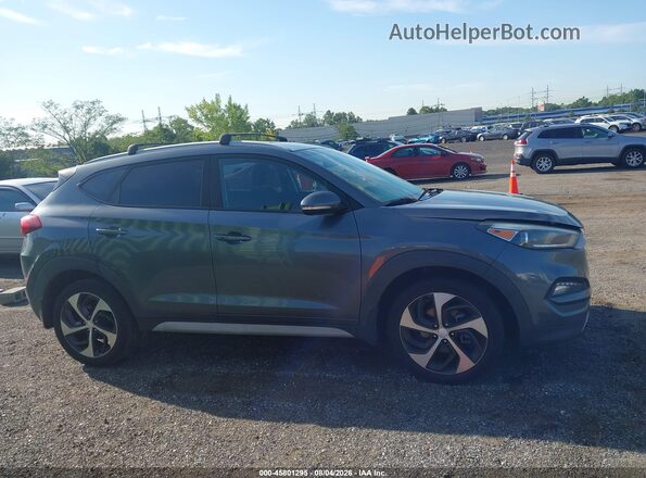 KM8J3CAL7JU716583 2018 HYUNDAI TUCSON Gray Vista interior trasera