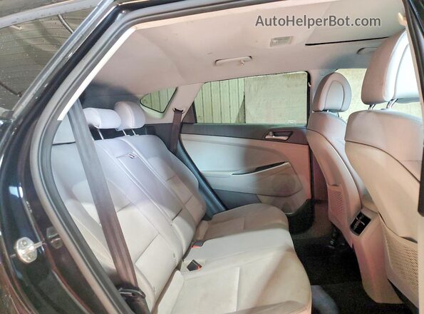 KM8J3CALXJU763834 2018 HYUNDAI TUCSON Black Rear interior view