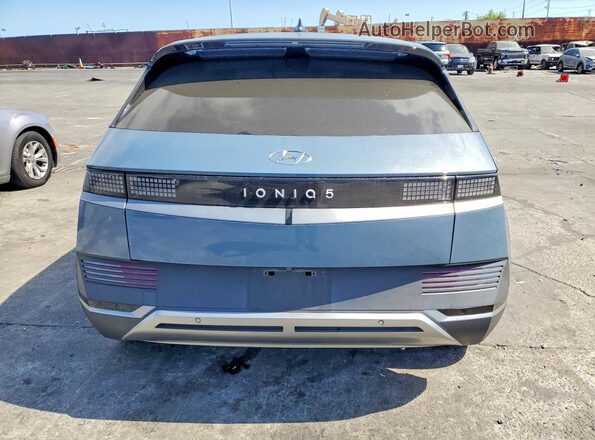 KM8KM4AE7NU053515 2022 HYUNDAI IONIQ Blue უკანა ხედი
