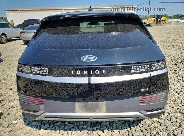 KM8KNDAF2PU183209 2023 HYUNDAI IONIQ Черный Вид сзади