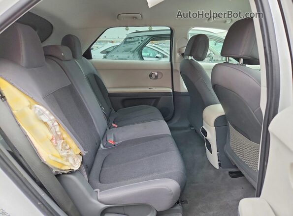 KM8KNDDFXRU273979 2024 HYUNDAI IONIQ White Հետևի նստատեղերի տեսք