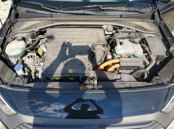 KMHC65LC0HU030601 2017 HYUNDAI IONIQ Black Rear interior view