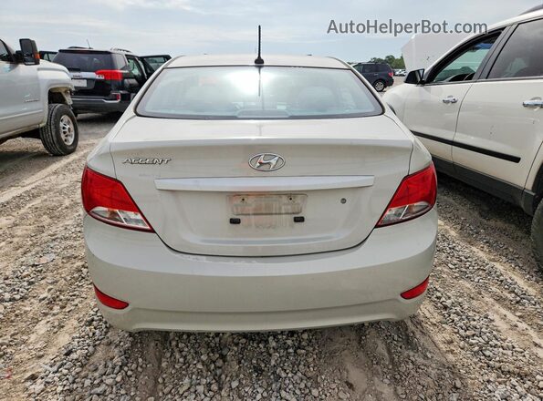 KMHCT4AE0GU090867 2016 HYUNDAI ACCENT Beige უკანა ხედი