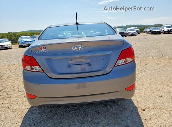 KMHCT4AE7GU945533 2016 HYUNDAI ACCENT Gray Rear view