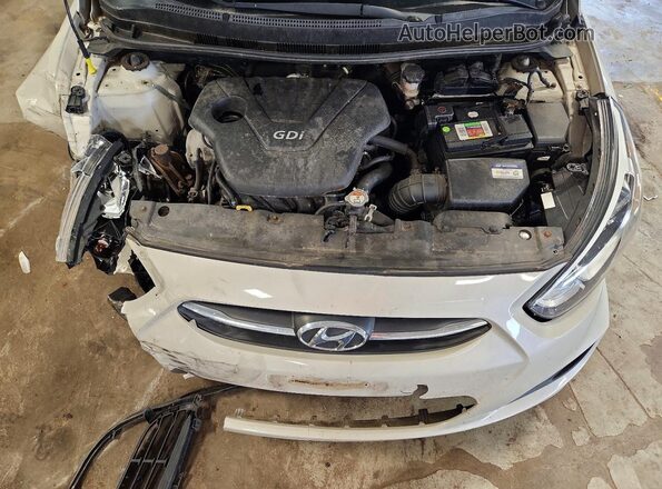 KMHCT4AE7GU952627 2016 HYUNDAI ACCENT Beige Սալոնի հետևի տեսք