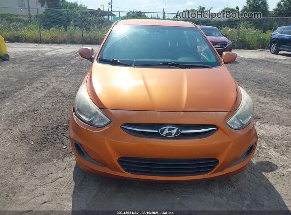 KMHCT5AE9GU244269 2016 HYUNDAI ACCENT Orange Front view