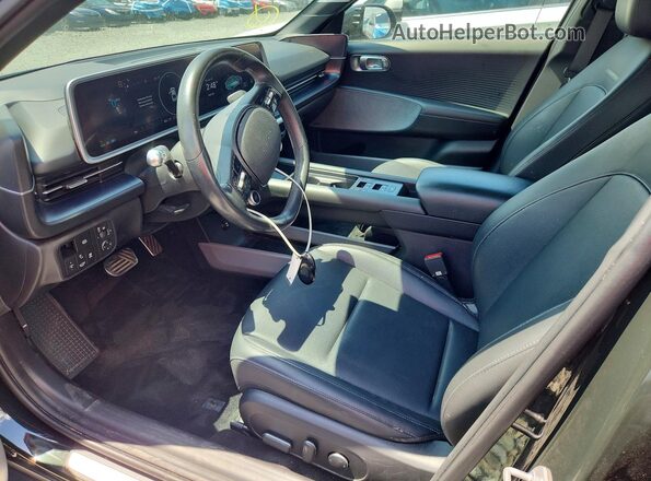 KMHM54AC3PA026577 2023 HYUNDAI IONIQ Черный Вид салона спереди
