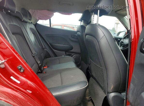 KMHRC8A36RU299999 2024 HYUNDAI VENUE Red Rear seats view