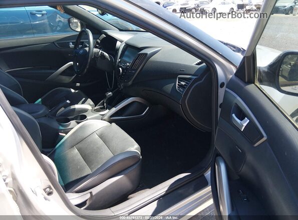 KMHTC6AE6GU299459 2016 HYUNDAI VELOSTER Серебряный Вид салона спереди