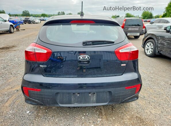 KNADM5A37G6735994 2016 KIA RIO Black Vista trasera