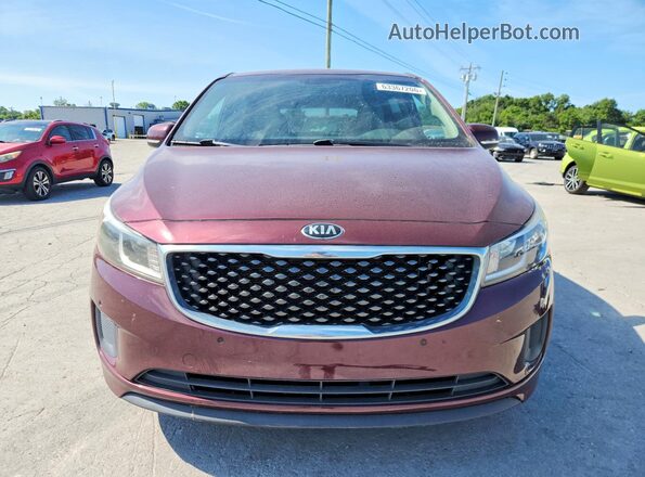 KNDMB5C10H6338665 2017 KIA SEDONA Maroon Front view
