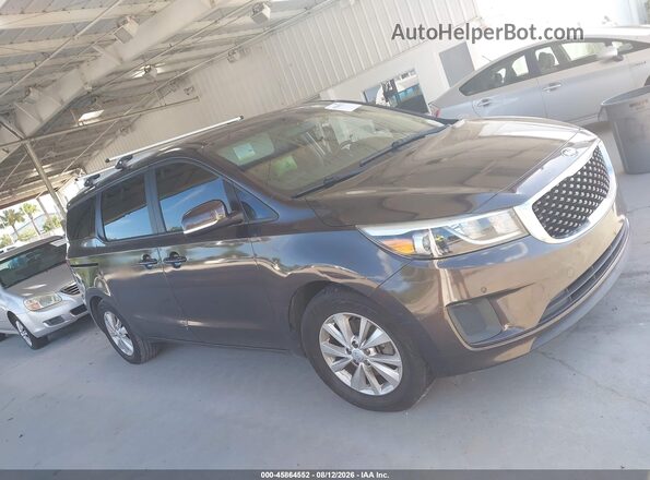 KNDMB5C13H6270314 2017 KIA SEDONA Brown Rear interior view