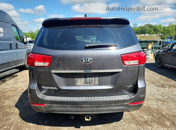 KNDMB5C17H6300883 2017 KIA SEDONA Gray Вид ззаду