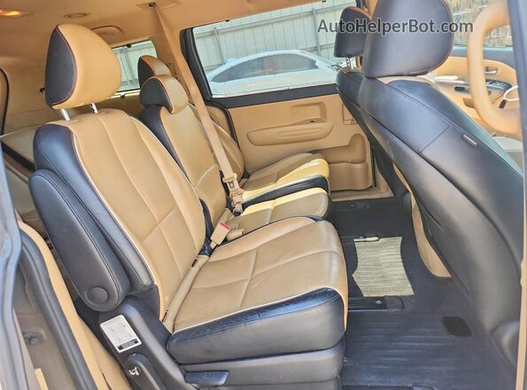 KNDMB5C18H6266842 2017 KIA SEDONA Gold Rear interior view