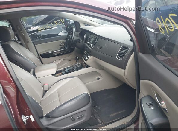 KNDMC5C14G6128680 2016 KIA SEDONA Maroon Вид салону спереду
