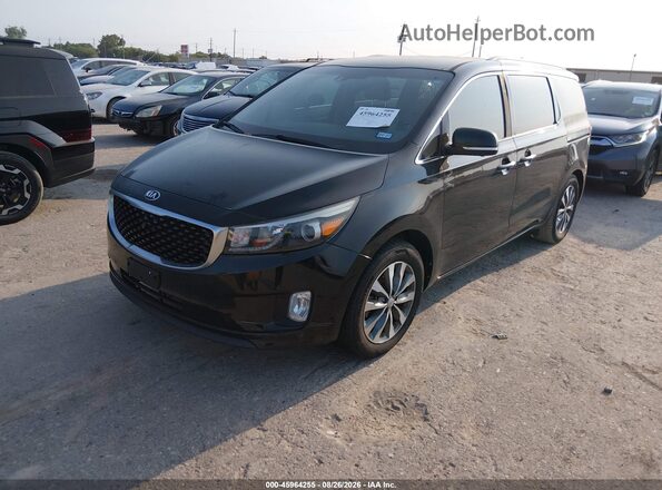 KNDMC5C1XG6175017 2016 KIA SEDONA Black Przód lewy