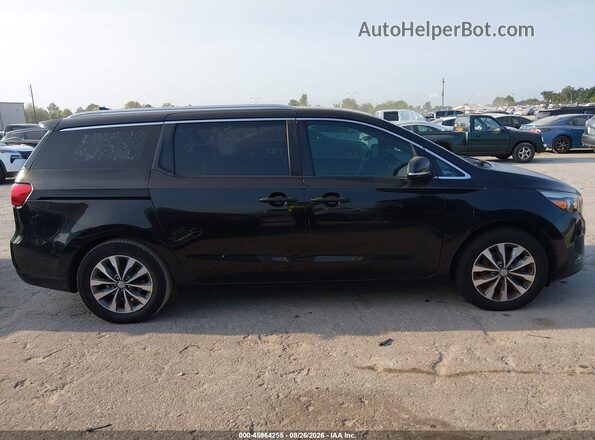KNDMC5C1XG6175017 2016 KIA SEDONA Black Widok wnętrza z tyłu